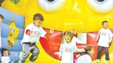Children playing at an Alkaloid family event