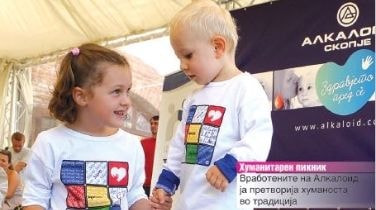 Children at the Alkaloid stand during a public event