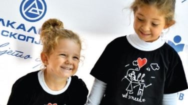 Two girls in Alkaloid t-shirts at a company family day