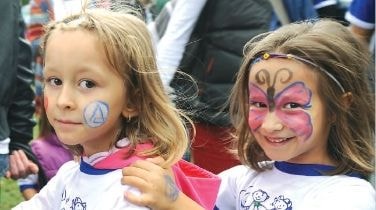 Girl with painted face at an Alkaloid children's event