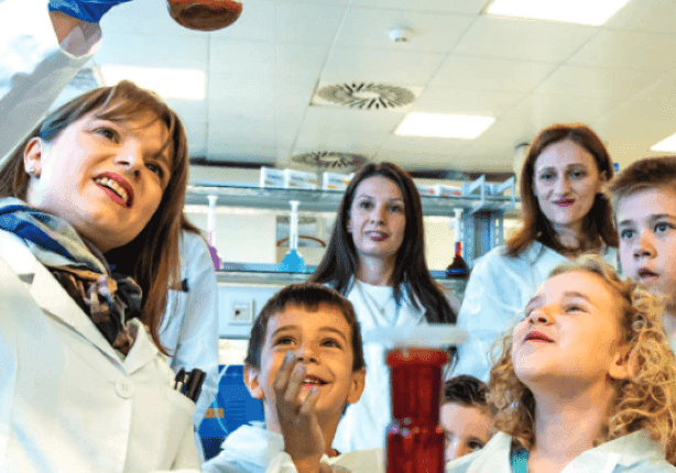 Cover of Health Above All issue 47, children at an Alkaloid event