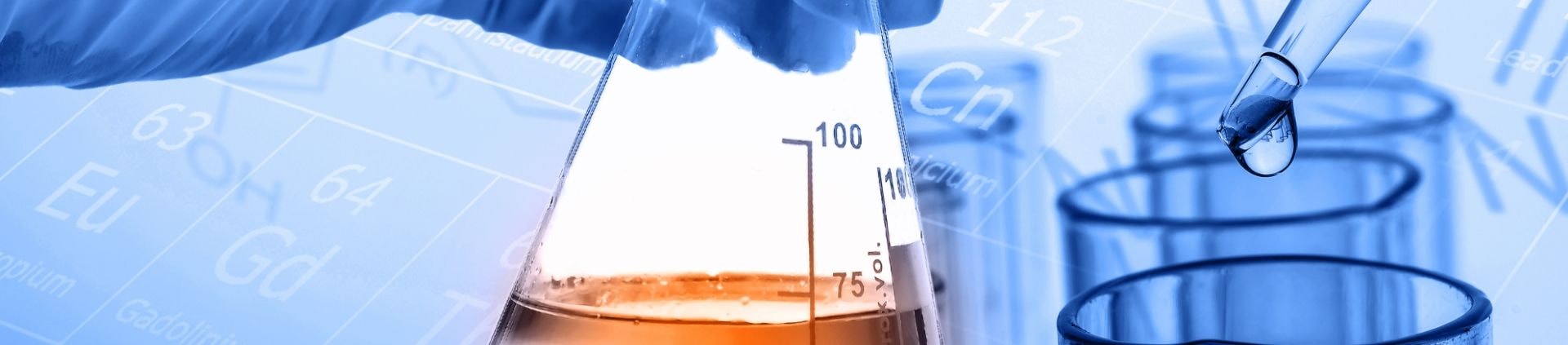 Laboratory glassware holding coloured chemical solutions
