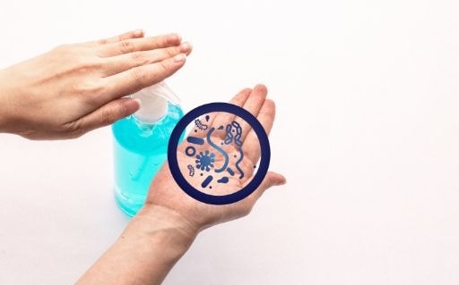 Hands applying antiseptic gel, with a germ graphic overlay