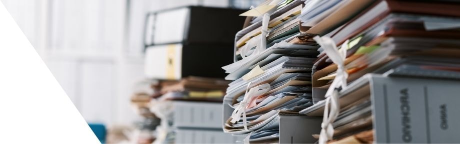 Stacks of archived paper documents in an office